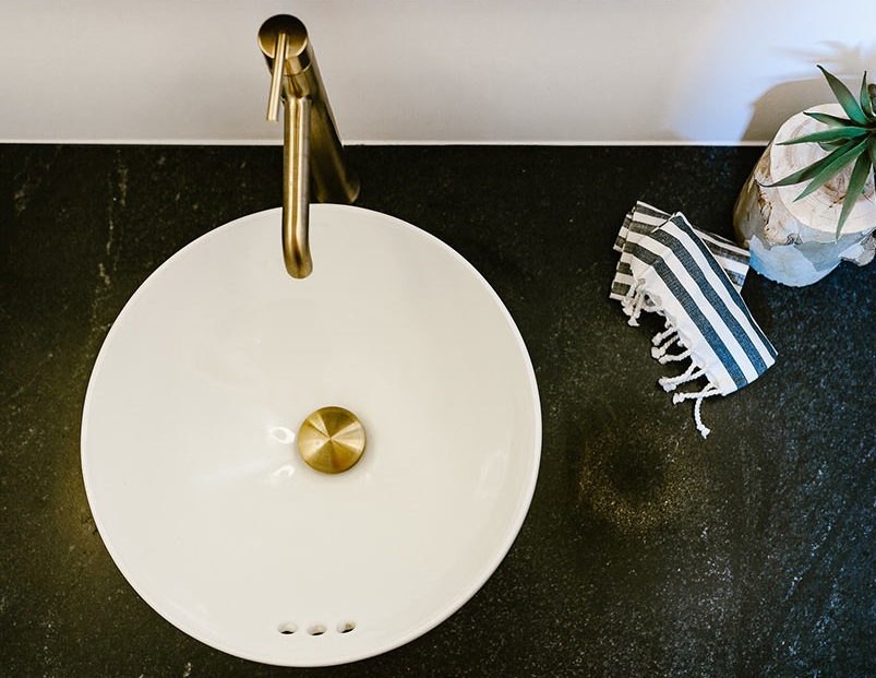 granite bathroom vanity with white vessel sink